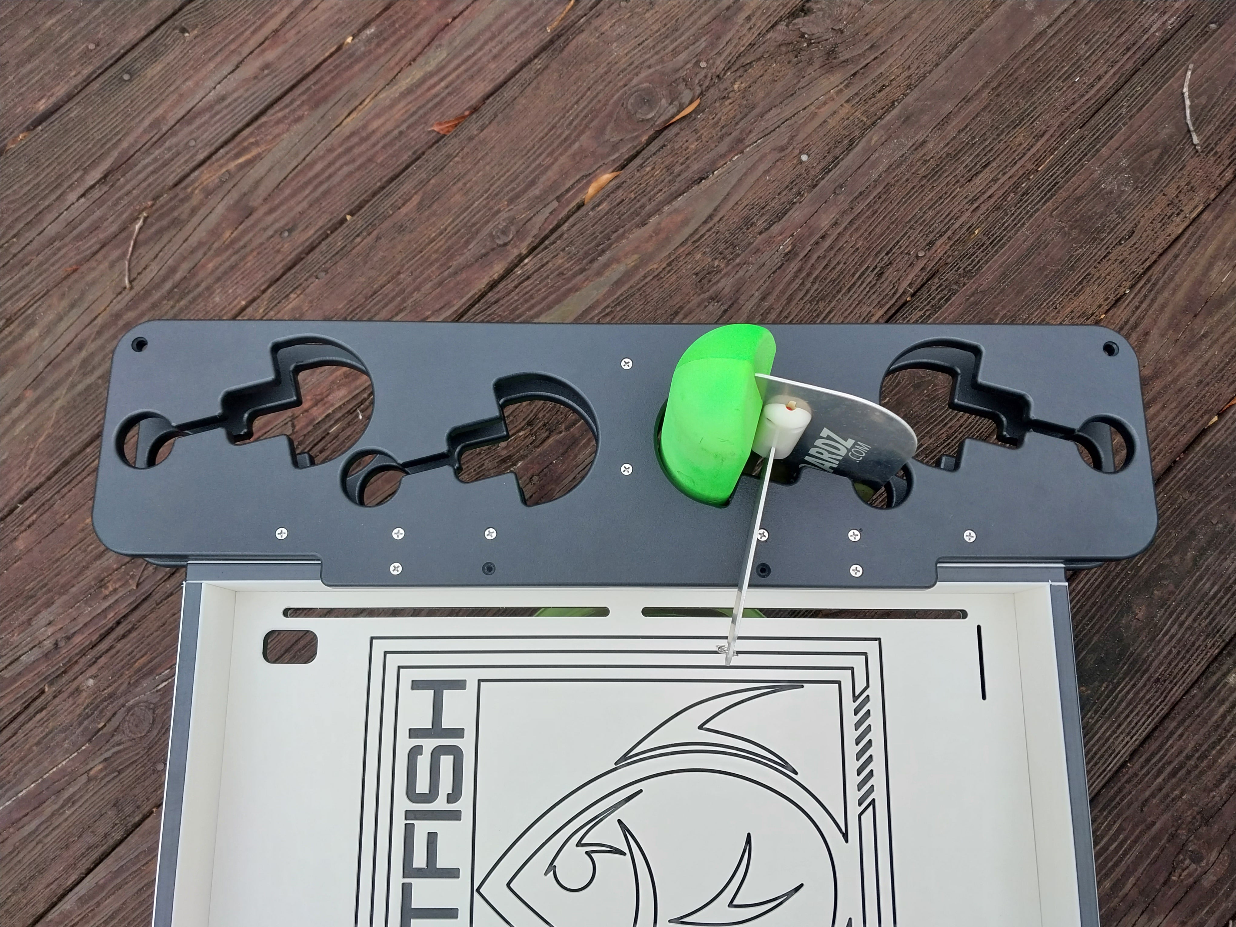 alpha boards planer board holder m ounted onto a fat fish designz cutting board color black.